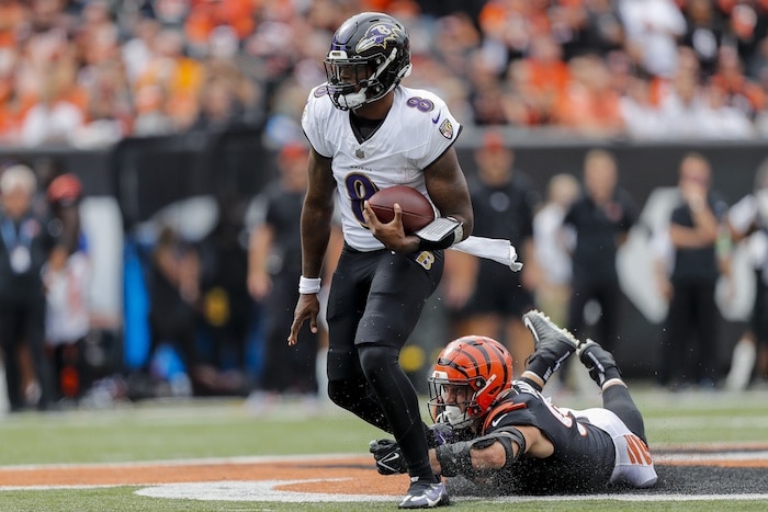 Baltimore Ravens quarterback Lamar Jackson (8) runs with the ball